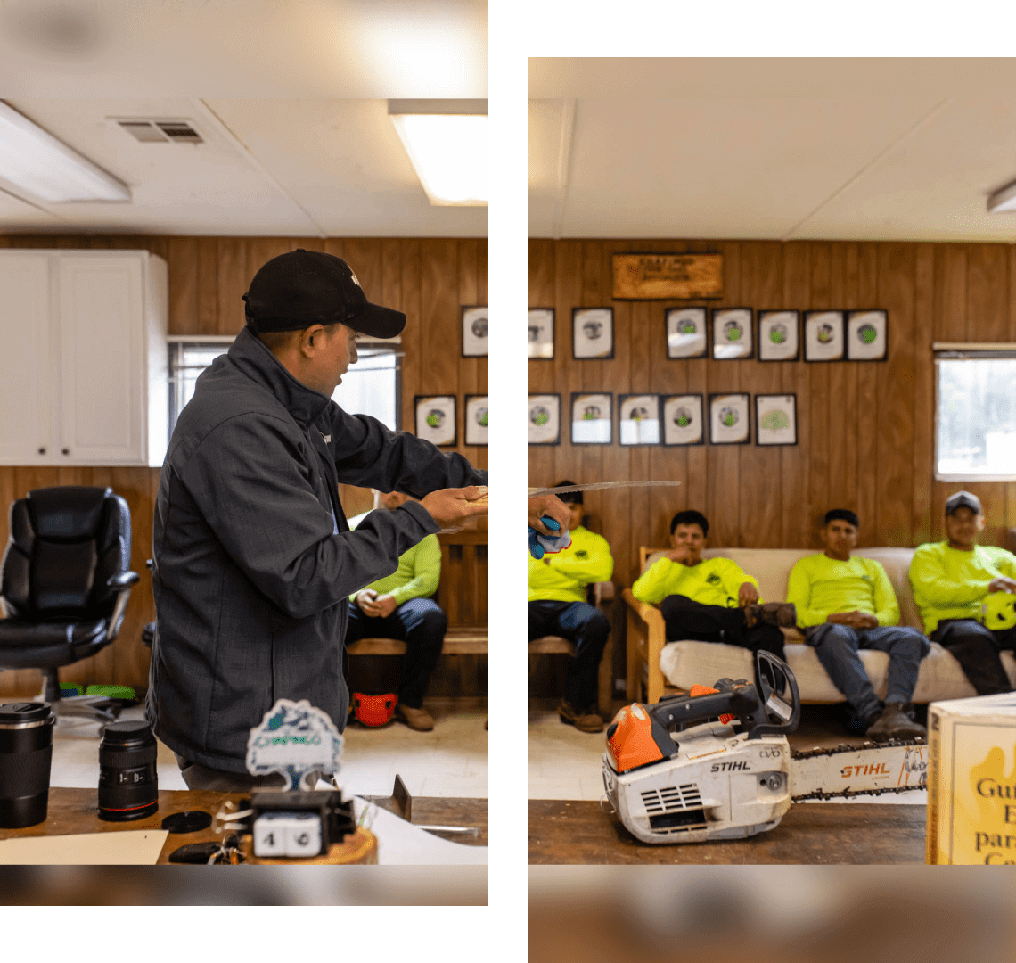 Teacher engaging students in a classroom activity with a model crane.